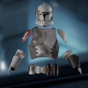 May include: A disassembled gray and white costume, including a helmet, chest armor, shoulder pads, arm guards, belt, and leg armor. The chest armor has a red and white emblem. The costume is designed to resemble a character from a science fiction franchise.