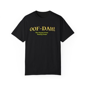 May include: Black t-shirt with gold text that reads "OOF-DAH! The Organic Farm Strategy Game"