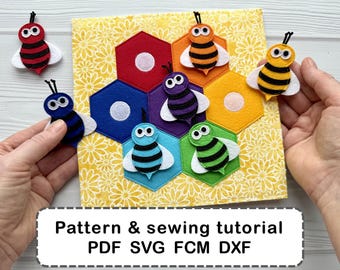 May include: A colorful felt bee-themed craft project. The image shows a yellow floral background with felt honeycomb shapes in red, orange, purple, blue, and green. Several felt bees in various colors are placed around the honeycomb. Text at the bottom reads "Pattern & sewing tutorial PDF SVG FCM DXF".