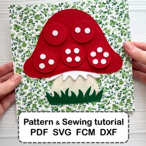 May include: A felt mushroom craft project featuring a red cap with white circular spots, a cream-coloured stem, and green grass at the base, set against a green floral background. The text reads: Pattern & Sewing tutorial PDF SVG FCM DXF.