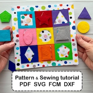 May include: A square felt shape matching board with a white background featuring colorful polka dots. The board contains nine distinct felt shapes in various colors including red, blue, yellow, and green. Additional loose felt shapes are included.