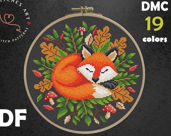 May include: Cross stitch pattern PDF for a sleeping fox surrounded by autumn leaves and mushrooms. The pattern uses 19 colours and is designed for 14 count Aida fabric. The finished size is 7.57 x 7.50 inches (19.23 x 19.05 cm).