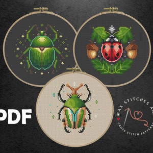 May include: Three embroidery patterns featuring a green beetle, a ladybug, and a green beetle with blue accents. The patterns are displayed on embroidery hoops. The text "PDF" is in the bottom left corner of the image. The text "MAX STITCHES ART CROSS STITCH PATTERNS" is in the bottom right corner of the image.
