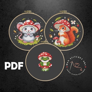 May include: Three cross stitch patterns featuring a mouse, squirrel, and frog wearing mushroom caps. The patterns are displayed in embroidery hoops on a dark gray background. The text "PDF" and "MAX STITCHES ART CROSS STITCH PATTERNS" are also visible.