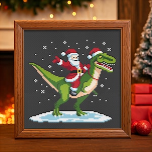 May include: A cross-stitch pattern of Santa Claus riding a dinosaur in a snowy scene. The dinosaur is green and Santa Claus is wearing a red suit with white trim.