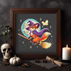 May include: A cross-stitch pattern of a fox wearing a purple witch hat and riding a broomstick in front of a full moon. The fox is flying through the night sky with stars and a butterfly.