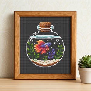 May include: A cross-stitch pattern of a glass bottle with a cork stopper, containing a colorful betta fish and green and purple plants. The bottle is on a dark gray background.