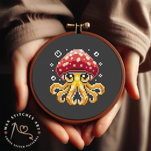 May include: A cross stitch pattern featuring a cartoon mushroom with an octopus body. The mushroom is red with white spots and the octopus is yellow with black eyes.