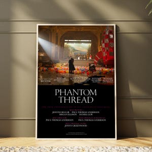 May include: A movie poster for Phantom Thread featuring a scene of two figures standing on a stage covered in colorful balloons with a large red rocket prop. The poster includes white text listing award wins and production credits on a black background.