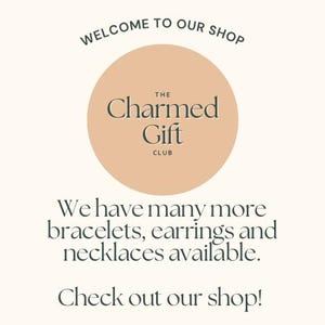 May include: An image with text that reads "WELCOME TO OUR SHOP" at the top. A circular logo in the center says "The Charmed Gift Club". Below the logo, the text reads "We have many more bracelets, earrings and necklaces available. Check out our shop!"