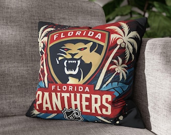 May include: Square throw pillow featuring the Florida Panthers logo. The design includes a snarling panther head, palm trees, and the words "FLORIDA PANTHERS" in a distressed, vintage style. The pillow is primarily red, black, and gold.