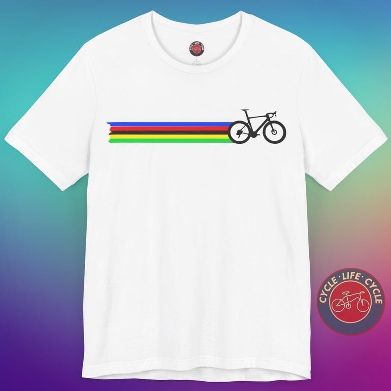 May include: White t-shirt with a black silhouette of a bicycle and a rainbow stripe across the chest. The shirt has a small red logo on the front with the text "CYCLE LIFE CYCLE" in a circle.