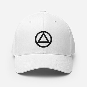 May include: White baseball cap with a black circle and triangle design. The triangle is inside the circle.