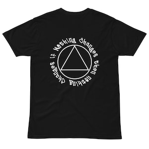 May include: Black t-shirt with a white circle graphic featuring a triangle and the text "Nothing changes the direction if it shadows".