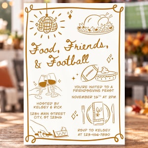 May include: A white invitation card with gold line art featuring a disco ball, a roasted turkey, wine glasses, a football, and a place setting. The text reads Food, Friends, & Football, You're invited to a Friendsgiving feast, November 15th at 2pm.