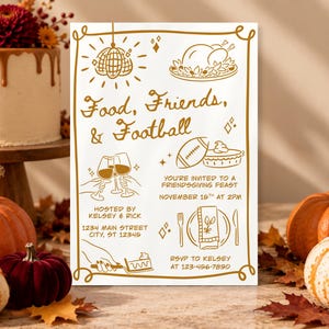 May include: A rectangular white invitation card with gold line art featuring a disco ball, a roasted turkey, a football, wine glasses, and a place setting. The text reads Food, Friends, & Football, You're invited to a Friendsgiving feast, November 15th at 2pm, hosted by Kelsey & Rick, 1234 Main Street, City, ST 12345, RSVP to Kelsey at 123-456-7890.
