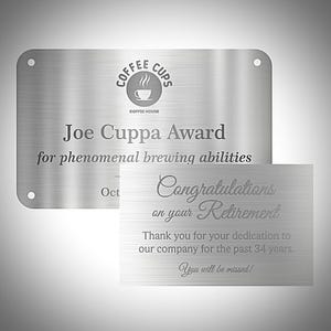 May include: A brushed metal plaque and card. The plaque reads "Joe Cuppa Award" with the Coffee Cups logo. The card says "Congratulations on your Retirement" and "You will be missed!"