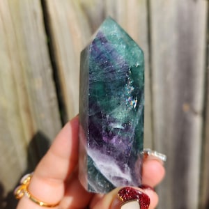 Stunning natural dark green and purple fluorite tower with rainbows 13A