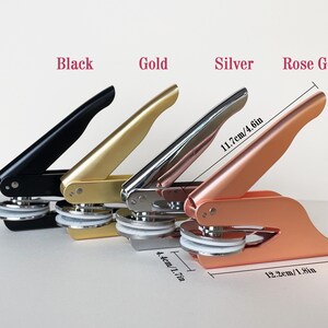 May include: Four metal seal presses in black, gold, silver, and rose gold. The rose gold press measures 4.6 inches long and 1.8 inches wide. The image includes text that reads "Black", "Gold", "Silver", and "Rose Gold".