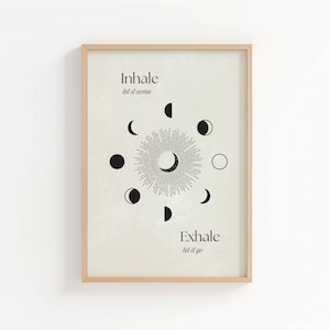 May include: A beige printable wall art print with a black and white moon phases design. The print features the text "Inhale let it come" and "Exhale let it go".