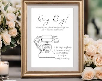 May include: A white sign with a black and white illustration of a vintage rotary phone. The sign reads "Ring Ring! The Smith's can't come to the phone right now... leave a message after the tone 1. Pick up the phone 2. Leave a message after the tone 3. Hang up 4. Keep dancing!"
