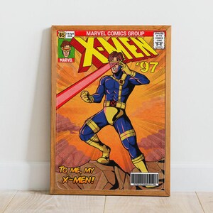 Puede incluir: Una portada de c&oacute;mic enmarcada con los X-Men. La obra de arte representa a C&iacute;clope con un traje azul y amarillo, disparando un rayo rojo. El texto incluye "X-MEN", "97" y "TO ME, MY X-MEN!" en un estilo vintage.