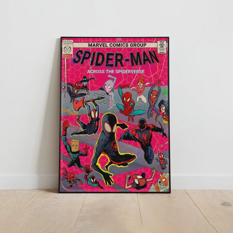 May include: A framed comic book cover featuring multiple Spider-Man characters against a pink background. The title "Spider-Man Across the Spider-Verse" is prominently displayed. The artwork is in a comic book style with vibrant colors and dynamic poses.