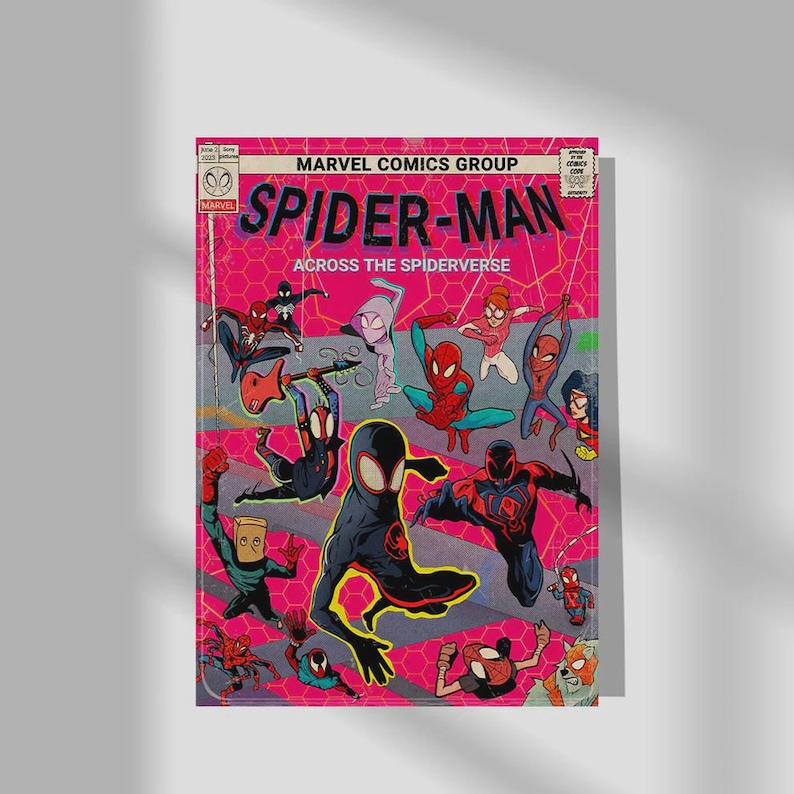 May include: A comic book cover for Spider-Man: Across the Spider-Verse. The cover features various Spider-Man characters in action poses against a pink background with the title and Marvel Comics Group logo.