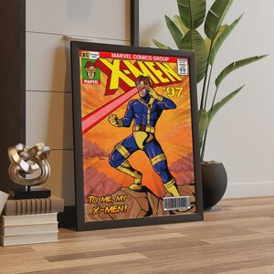 Puede incluir: Portada de c&oacute;mic enmarcada con C&iacute;clope de X-Men. La obra muestra a C&iacute;clope con un traje azul y amarillo, disparando un rayo rojo desde sus ojos. La portada incluye el texto "X-MEN '97" y "TO ME, MY X-MEN!" en un estilo de c&oacute;mic vintage.