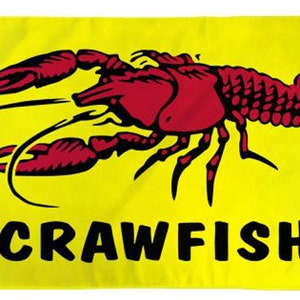 May include: A yellow flag with a red crawfish illustration and the word "Crawfish" in black letters.