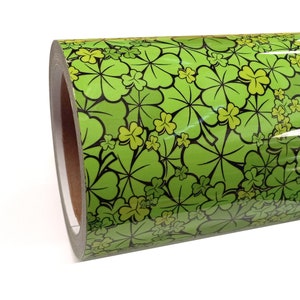 May include: A roll of green vinyl with a black and green four-leaf clover pattern.