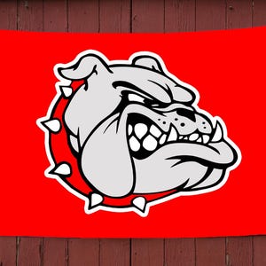 May include: A red flag with a white bulldog mascot. The bulldog has a spiked collar and a fierce expression.