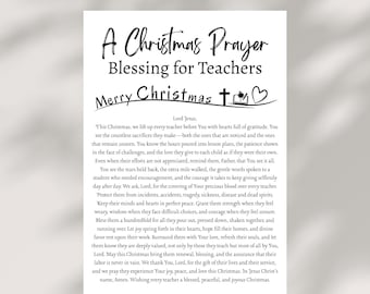 May include: A white print with the text "A Christmas Prayer Blessing for Teachers" and "Merry Christmas." The print includes a prayer for teachers, with a cross and heart graphic.