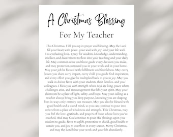 May include: A white card with the text "A Christmas Blessing For My Teacher" in elegant script. The card contains a heartfelt message of prayer and well wishes for a teacher during the Christmas season.