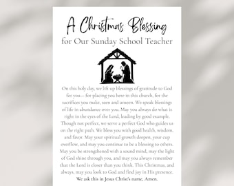 May include: A white card with the text "A Christmas Blessing for Our Sunday School Teacher" in black script. A black silhouette of the Nativity scene is centered above the text. The card contains a prayer.