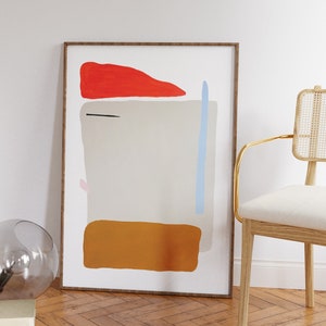May include: A framed abstract art print with a white background and geometric shapes in red, orange, blue, and black.