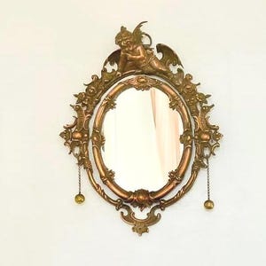Antique Bronze Cupid Mirror: 19th Century French Wall Decor