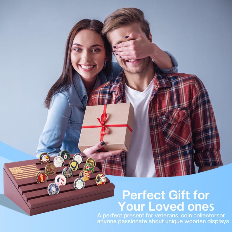 May include: A wooden coin display stand with an American flag design, holding various collectible coins. A couple is shown, one holding a wrapped gift with a red ribbon. The text reads "Perfect Gift for Your Loved ones."