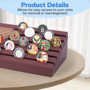May include: A burgundy coin display case with multiple rows, holding various colorful coins. The coins feature different designs, including flags, eagles, and military emblems. The text "Product Details" and "Allows for easy access to your coins for removal or rearrangement" is visible.