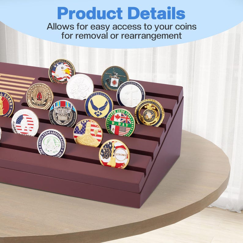 May include: A burgundy coin display case with multiple rows, holding various colorful coins. The coins feature different designs, including flags, eagles, and military emblems. The text "Product Details" and "Allows for easy access to your coins for removal or rearrangement" is visible.