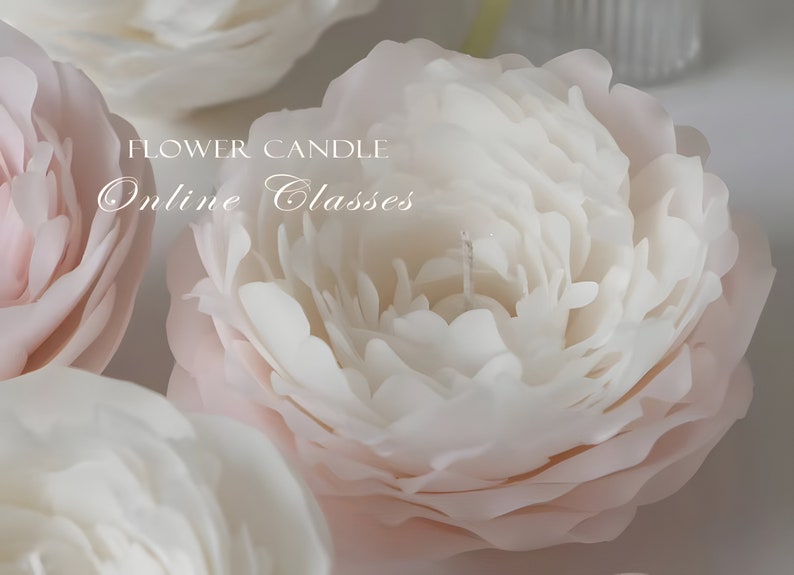 May include: Close-up of a white and pink flower candle. The candle is made to look like a peony flower. The text "FLOWER CANDLE Online Classes" is visible in the image.