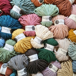 May include: A variety of colorful cotton rope, each skein labeled with the brand name "Bobbiny".