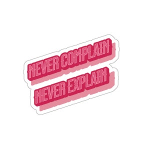 May include: Pink sticker with the text "Never complain, never explain" in white outlined letters.