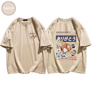 a pair of t - shirts with japanese writing on them