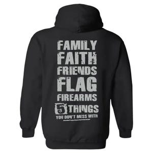 May include: Black hooded sweatshirt with the words "FAMILY, FAITH, FRIENDS, FLAG, FIREARMS, 5 THINGS YOU DON'T MESS WITH" printed in distressed gray lettering. The hoodie has a drawstring and a kangaroo pocket.