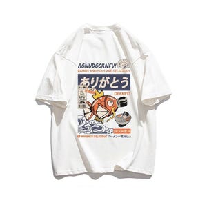 a white t - shirt with a picture of a fish on it