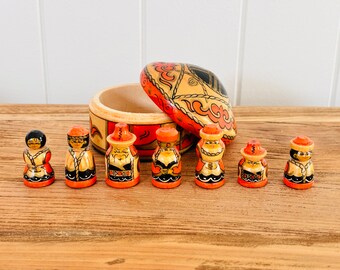 Vintage Eastern European (Russian?) wooden trinket box filled with family of tiny wooden dolls
