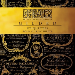 May include: Gold foil design on black background with text "Iron Orchid Designs Gilded" and "Etiquettes Four 12" x 16" Sheets". The design features various vintage-style illustrations and text in French.