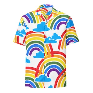 May include: A white short-sleeved button-down shirt with a colorful rainbow and cloud pattern.