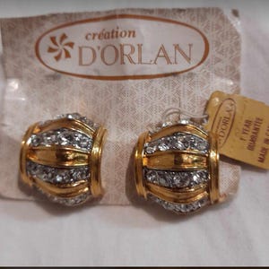 Brincos D’orlan Clip on em cartão original. Feito no Canadá